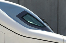 Determining the optimum speed of a high-speed train in order to minimize carbon dioxide emissions in a corridor